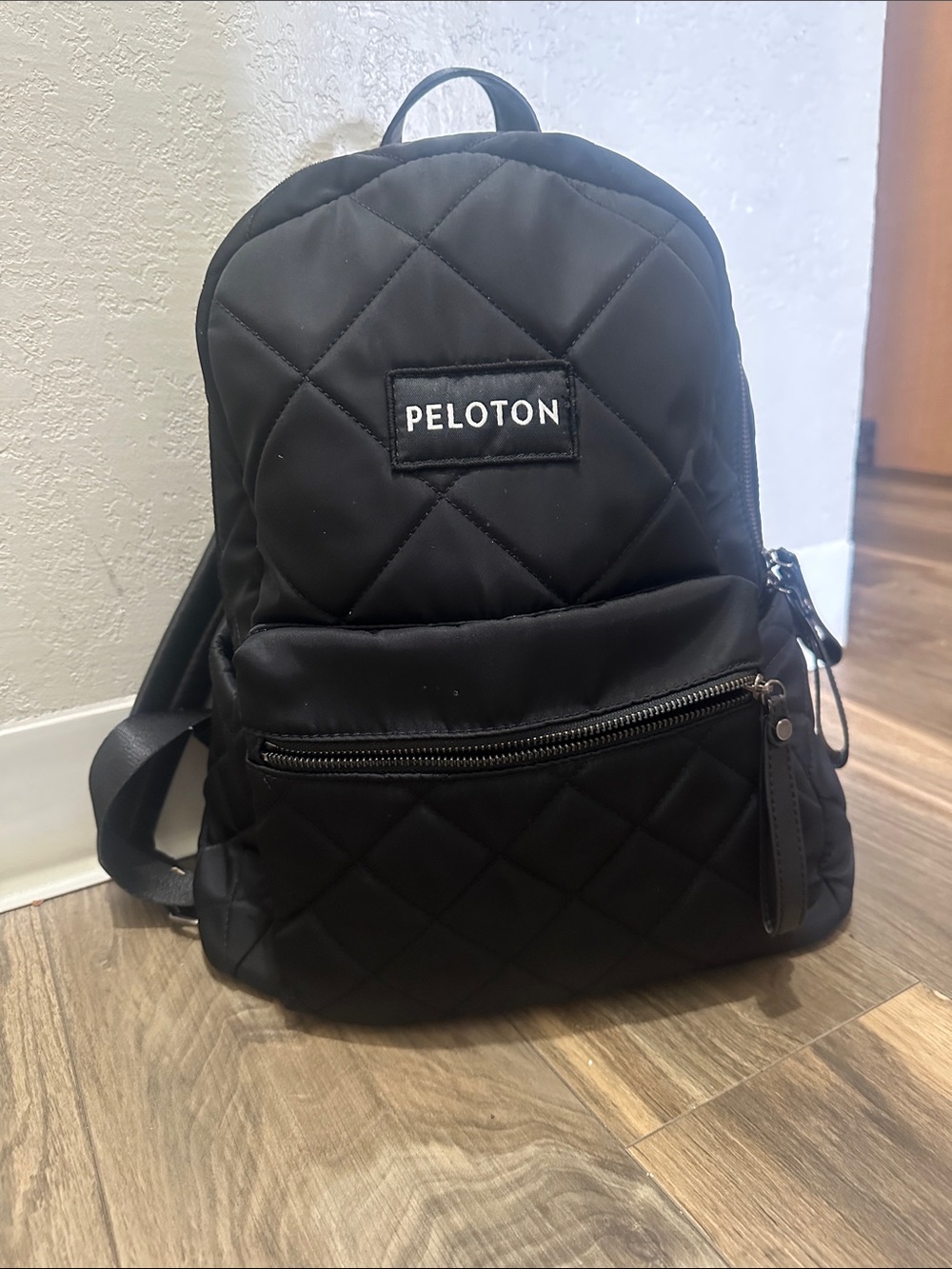 Peloton Black Quilted Men's Backpack with Front Zip Pocket